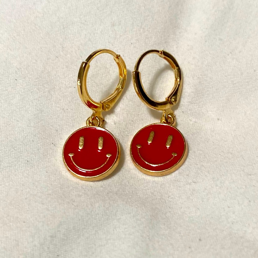 Red in color smiley face earrings